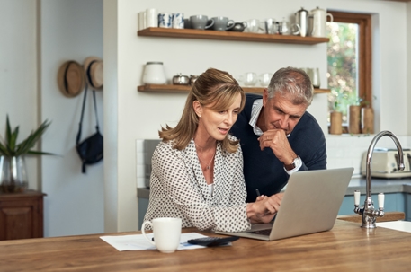 Couple reviewing estate plan on computer