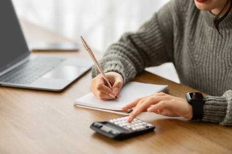 woman calculating budget
