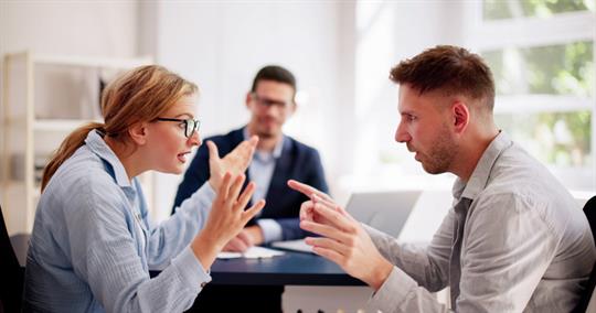 couple fighting in lawyer's office